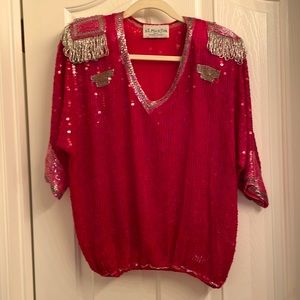 Vintage sequined. Padded shoulders. A bit sheer, just enough to be sexy.